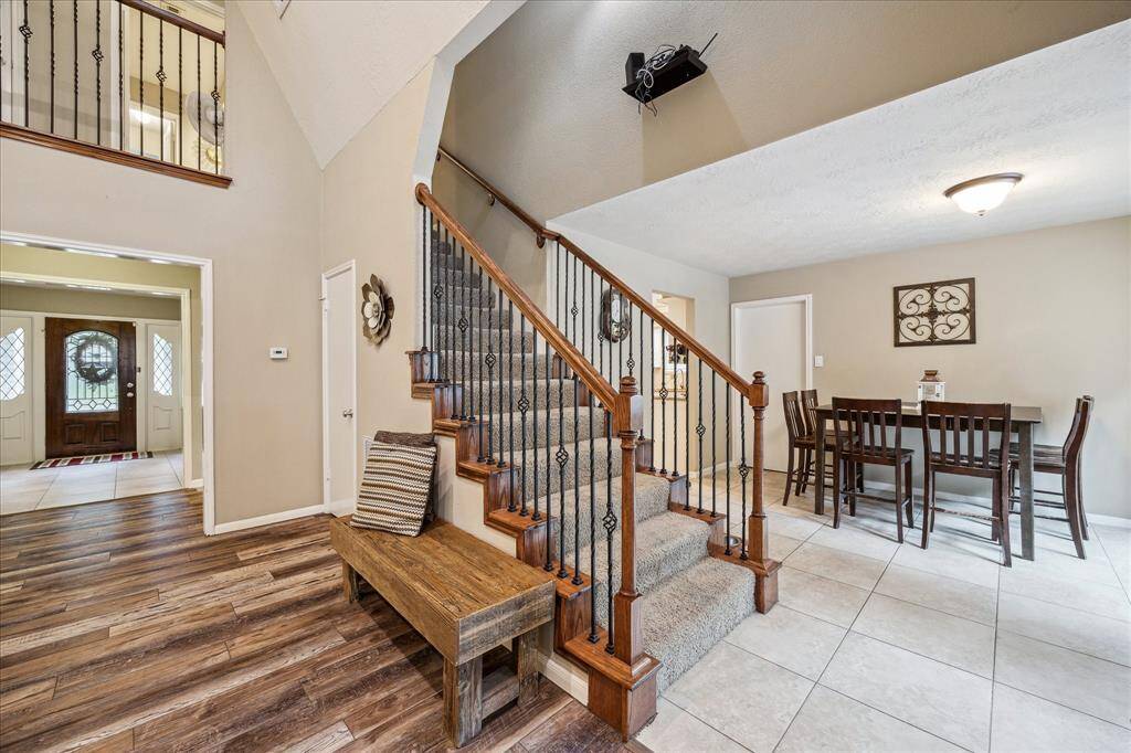 This beautifully designed home offers a seamless flow from room to room, perfect for both everyday living and entertaining. The open-concept layout, combined with vaulted ceilings and expansive windows, creates a bright, airy atmosphere that instantly feels like home.