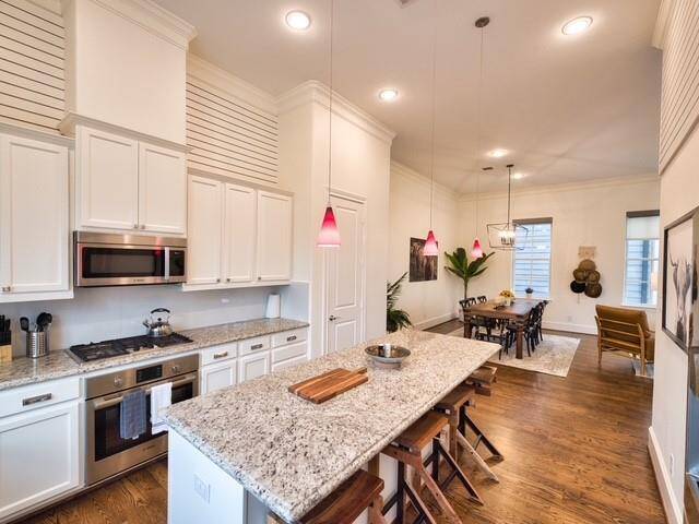 Beautiful granite counters as well as high end stainless appliances and a gas cooktop.