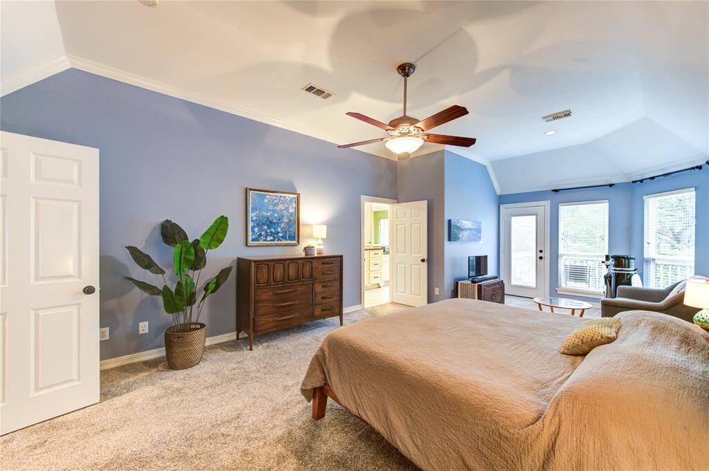 The spacious 3rd floor primary suite boasts plush carpet, high ceilings, and a sitting area with abundant natural light. A private balcony offers a quiet retreat to enjoy your morning coffee or unwind after a long day.