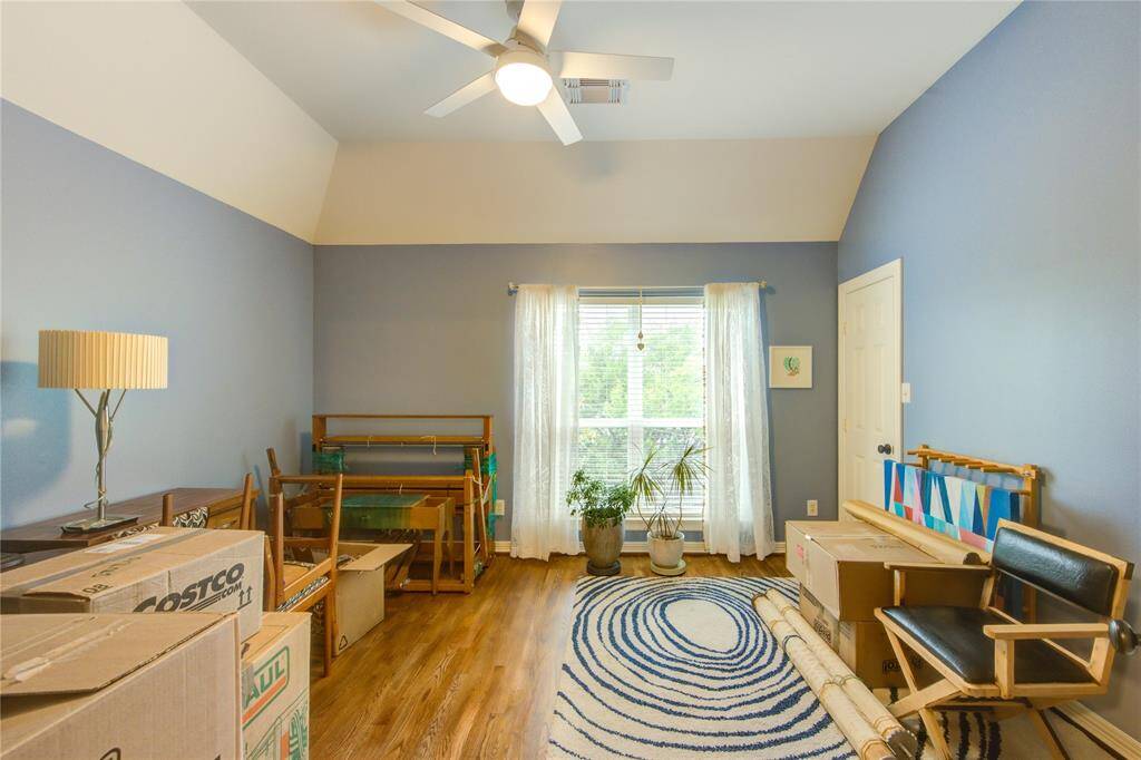 The secondary bedroom on the 3rd floor is spacious and bright, high ceilings,wood floors, and ample closet space. Ideal for family, guests, or a home office.