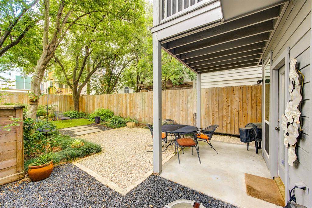 Designed for low-maintenance luxury, the fully fenced outdoor space blends lush landscaping, crushed stone pathways, and premium AstroTurf for a clean, contemporary look and feel. A covered patio offers the perfect shaded spot for dining al fresco, relaxing with a morning coffee, or entertaining guests in style.