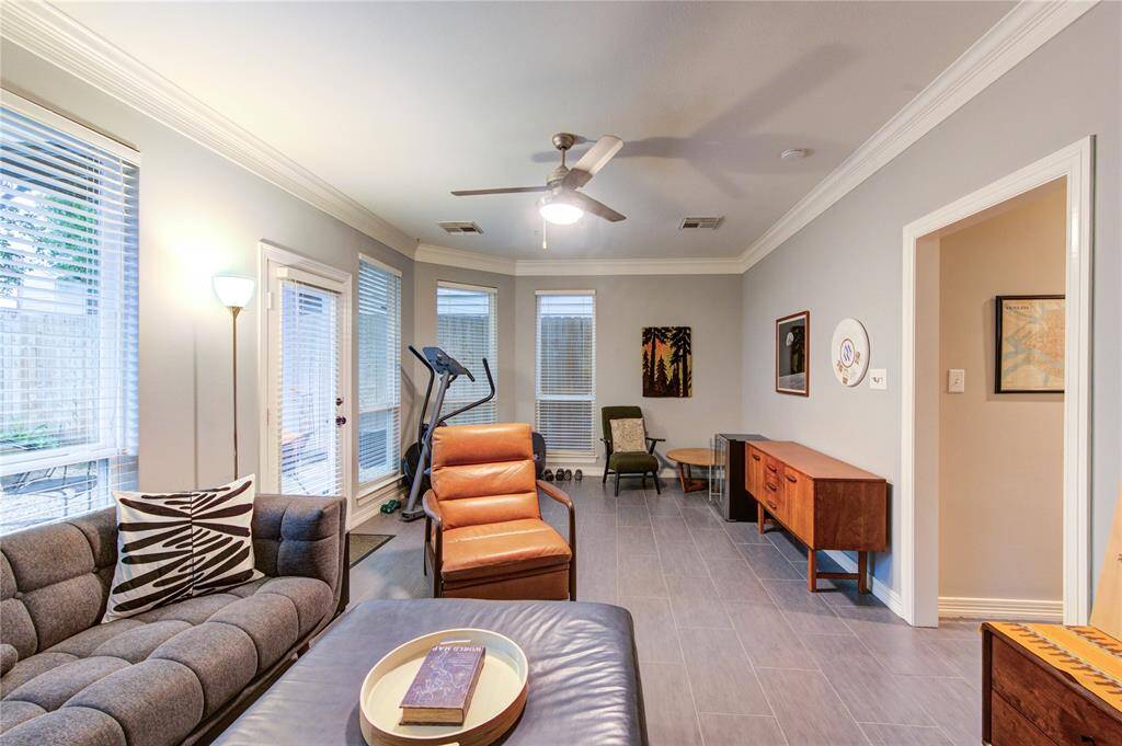Located on the 1st level, this versatile space can serve as a media room, home gym, or study area. Modern tile flooring and recessed lighting ensure comfort and flexibility.