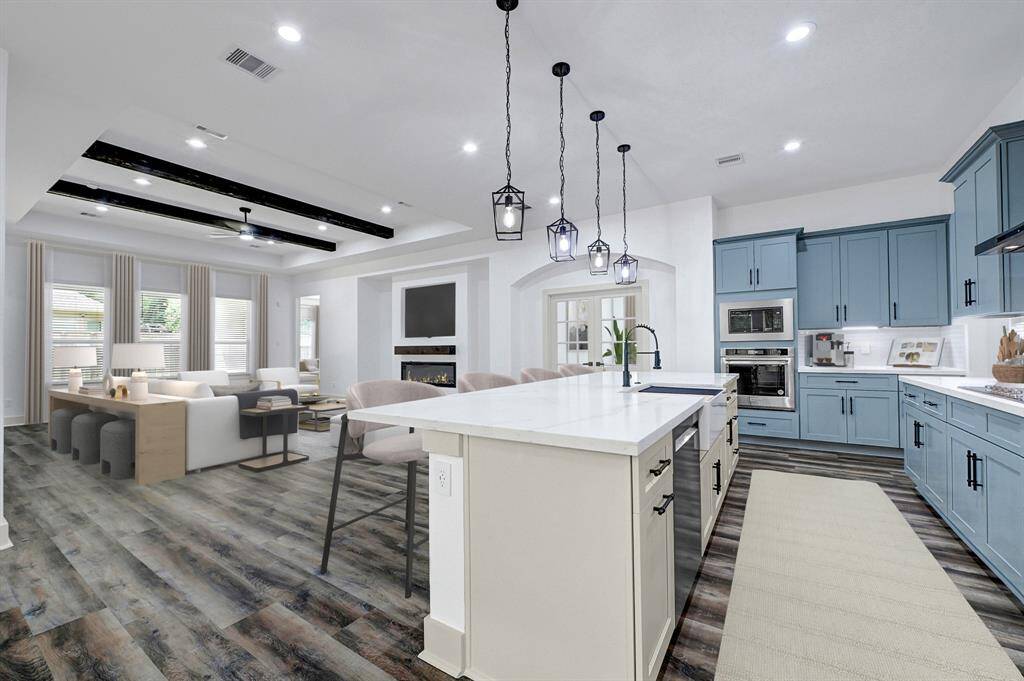 Living room/kitchen (photo is virtually staged)