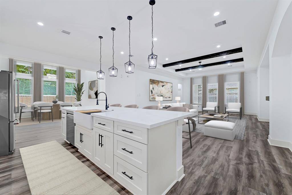 Kitchen open to living room and dining room, perfect for family time and entertaining. (photo is virtually staged)
