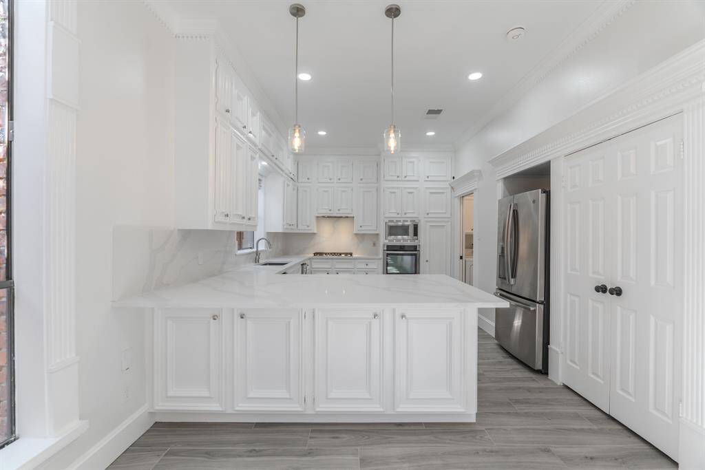 Custom Touches: Stylish Upgrades Throughout, Showcasing Attention To Detail.