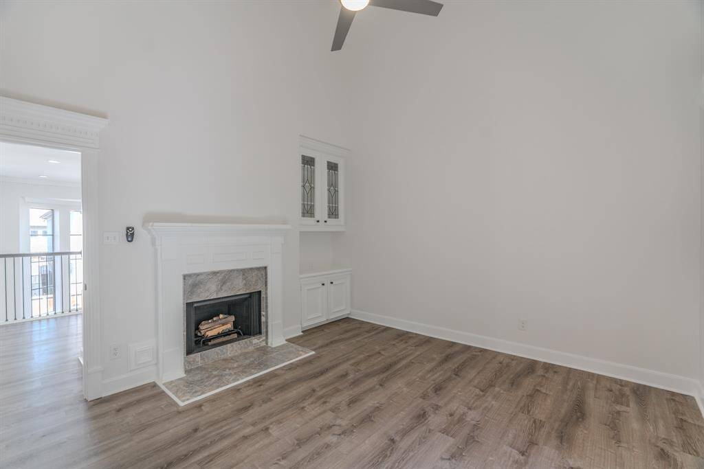 Another View Of this Spacious Secondary Bedroom Upstairs. Includes Functional Gas Fireplace. Could be Flex Room or Bedroom.