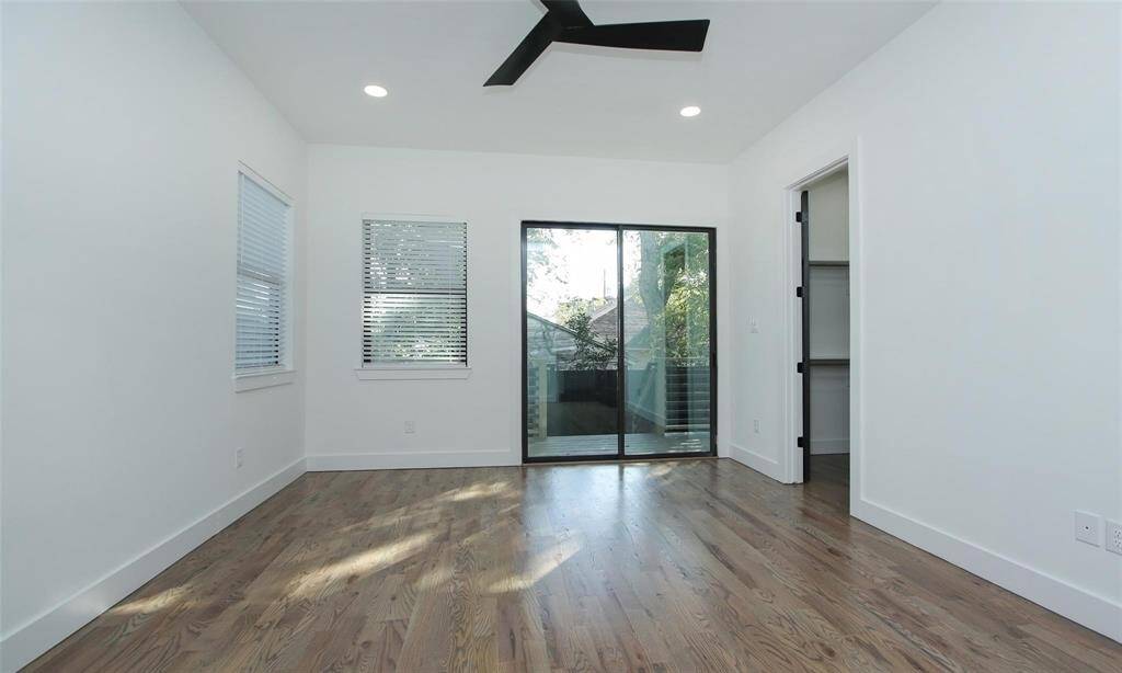 View from the sliding glass doors toward the hallway and ensuite bathroom.