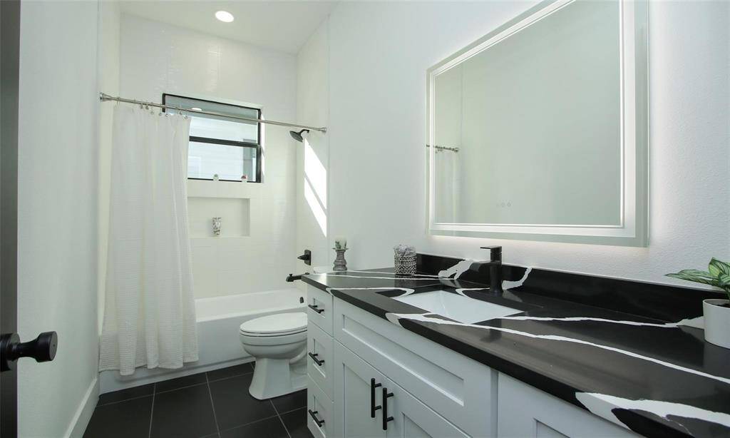 Third bedroom located upstairs sharing the same hallway as the full bathroom.
