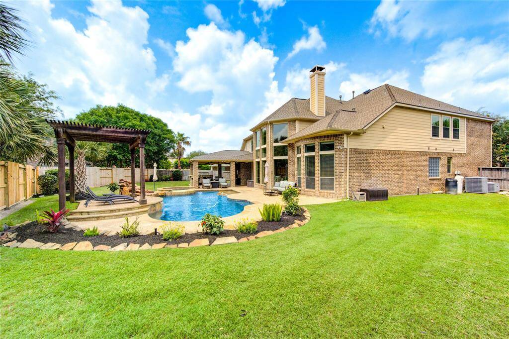 The next BridgelandFamily will enjoy living on a cul-de-sac and swimming in the custom family pool and cooking on the summer kitchen under the massive covered patio
