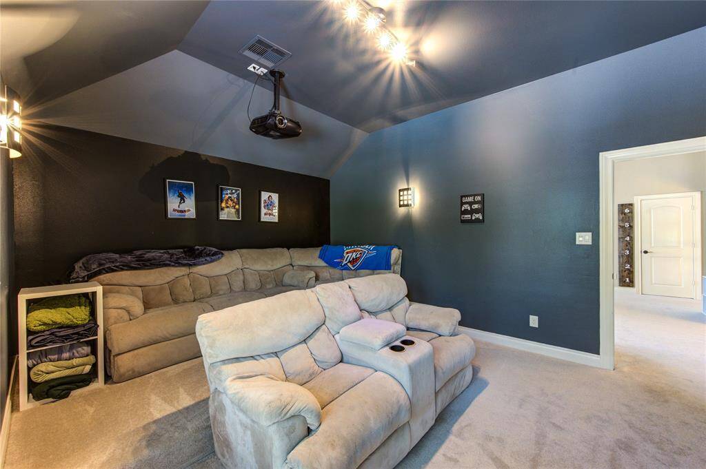 Upgraded and private multi-level media room with included projector and screen on the 2nd level. 17 feet by 14 feet.