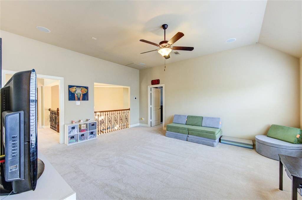 Massive upstairs game room offers a 1/2 bathroom + game closet. 19 feet by 16 feet.