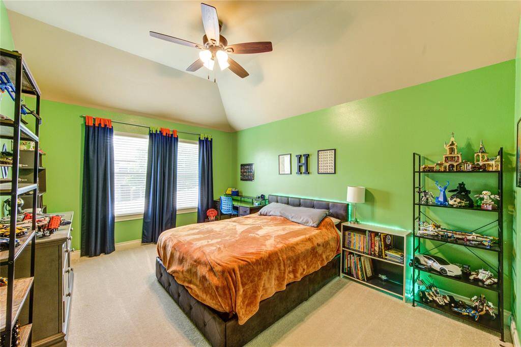 This bedroom overlooks the backyard and green spaces. This bedroom is 19 feet by 11 feet.