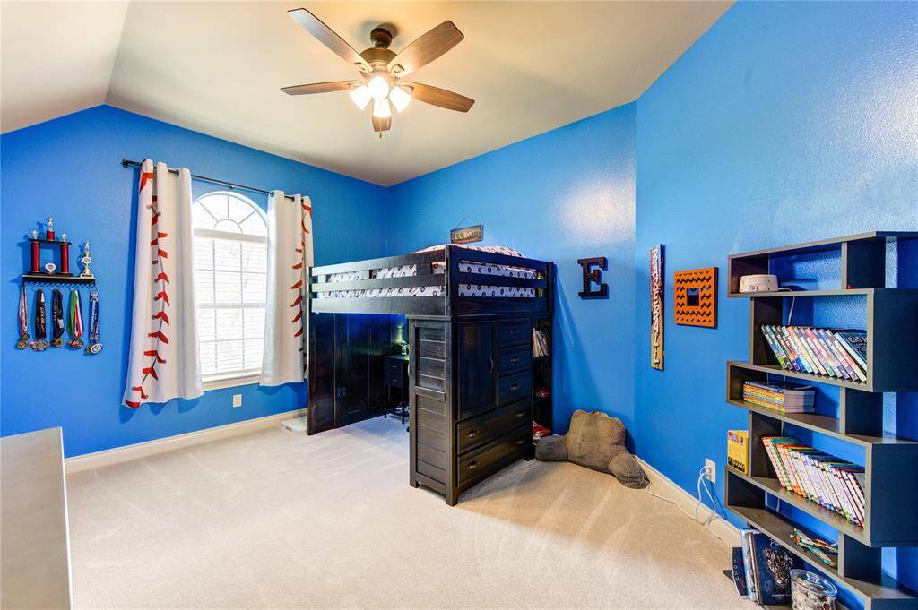 Upstairs bedroom. This bedroom overlooks the front of the home on a cul-de-sac. This bedroom is 21 feet by 12 feet.