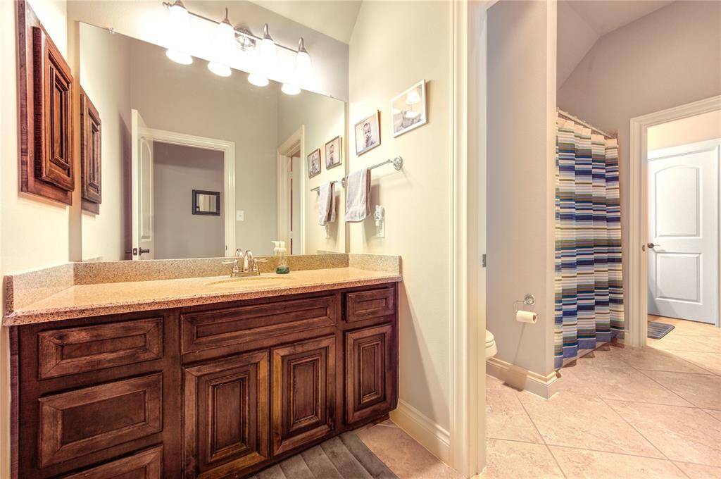 Jack and Jill bathroom connected to one of the upstairs bedrooms. Space si 18 feet by 7 feet