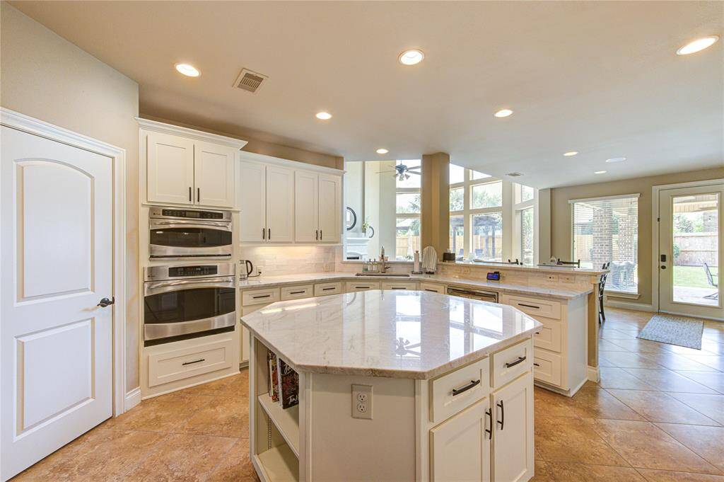 Upgraded and updated kitchen with 55 soft close cabinets and drawers with a separate coffee bar and walk-in pantry