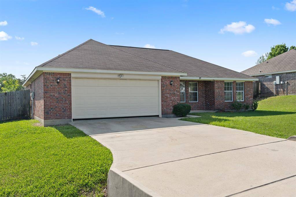 The well-maintained front yard and inviting entrance set the tone for this delightful residence