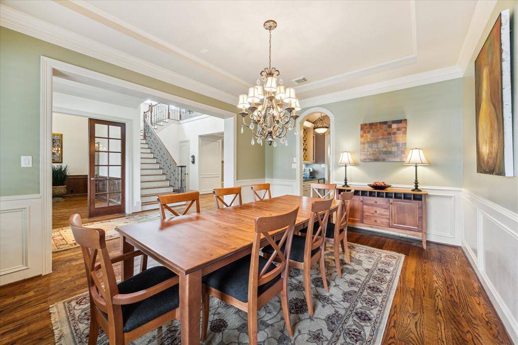 The formal dining room is seamlessly connected to the kitchen via a wet bar,creating an ideal flow for entertaining.