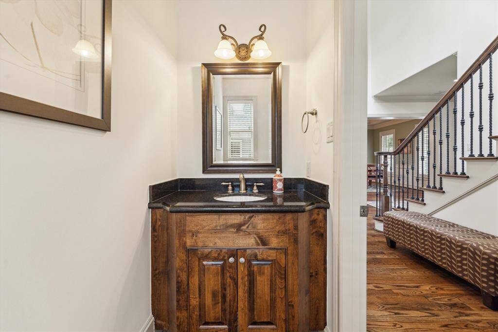 A stylish powder bath is conveniently located on the first floor, ideal for guests and everyday use.
