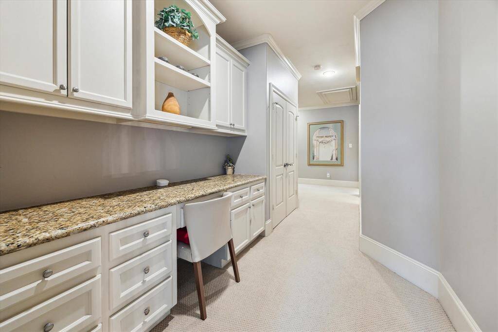 A convenient hallway workstation with plenty of storage.