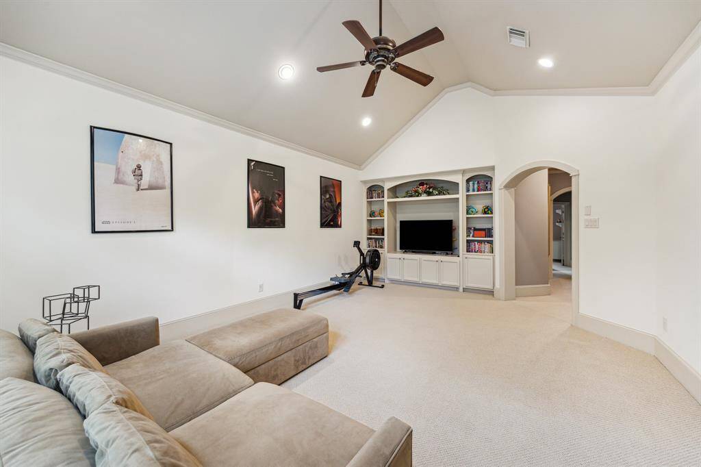 Large 2nd floor gameroom with vaulted ceilings that overlooks the backyard.