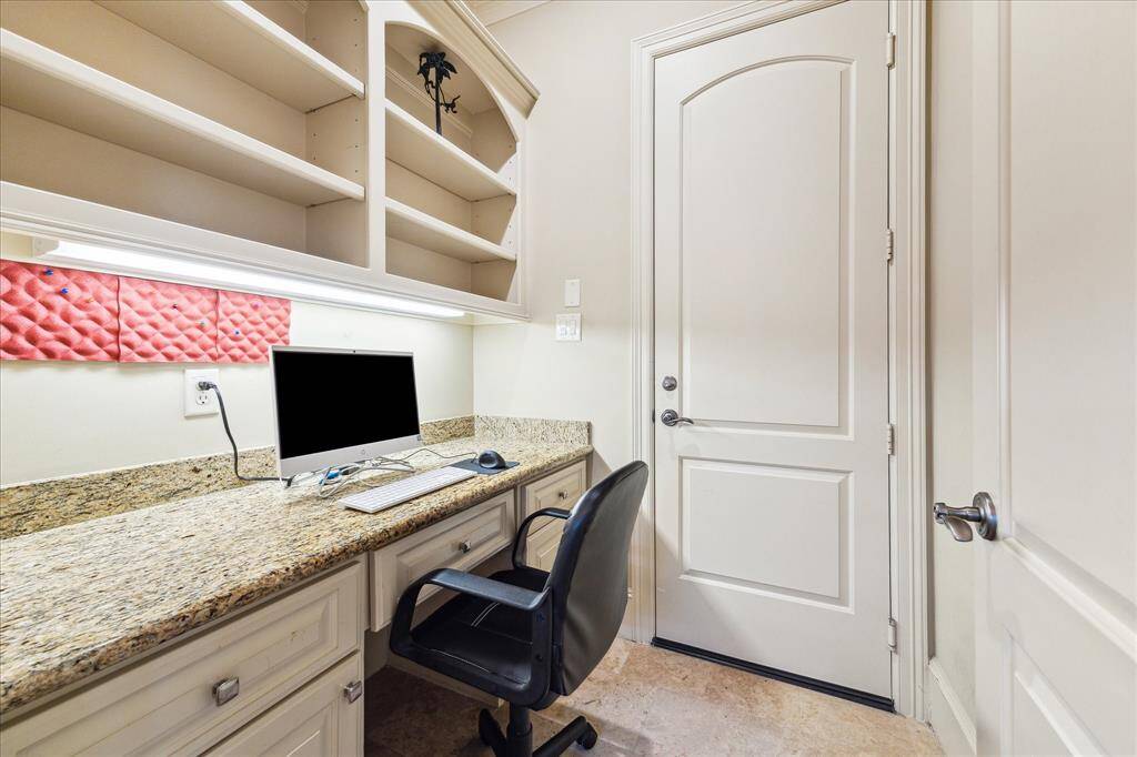 A conveniently located workstation on the first floor offers a dedicated space for work or study.
