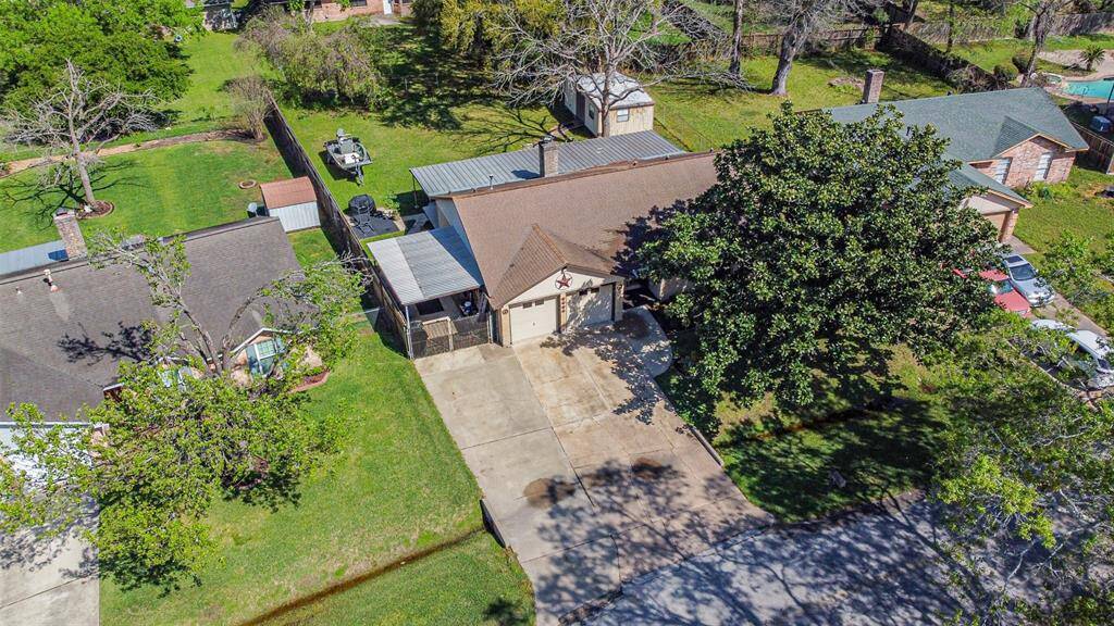 Aerial view of large lot and triple wide driveway