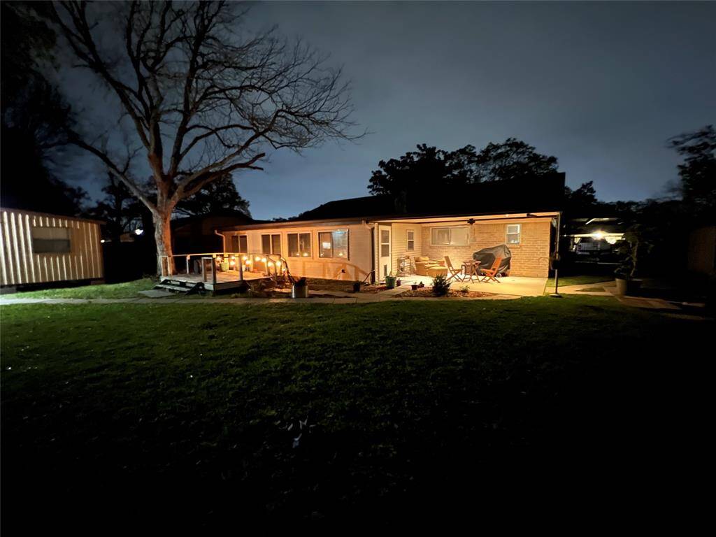Evening view of back patio and yard