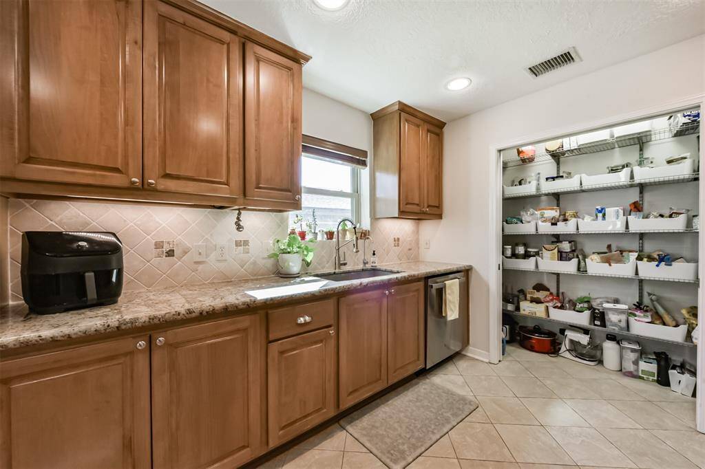 Large pantry with built-ins and pocket doors