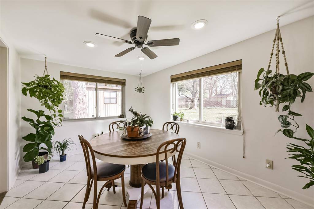 Light and bright breakfast room with lots of windows to let in natural light with access into Kitchen and secondary living space