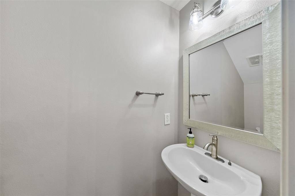 The half bath is conveniently located downstairs, providing easy access for residents and guests alike.