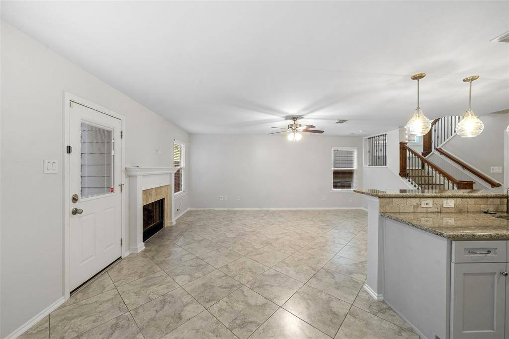 Enjoy a spacious view from the dining room, overlooking the inviting living room and providing access to the back door for easy outdoor living.
