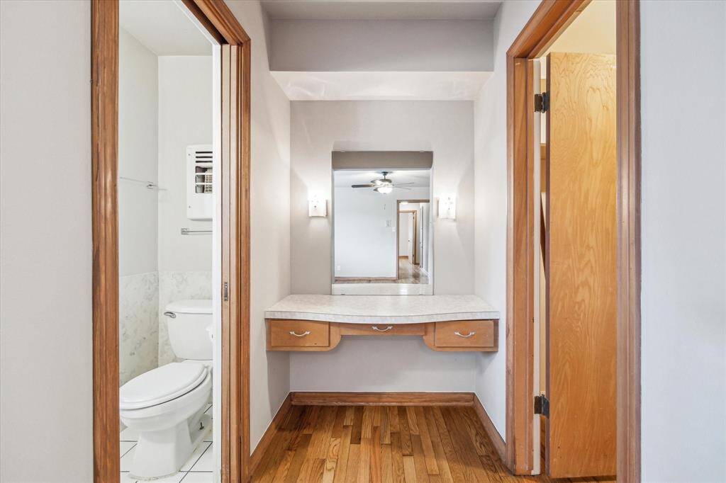 Primary suite with separate vanity and walk-in closet