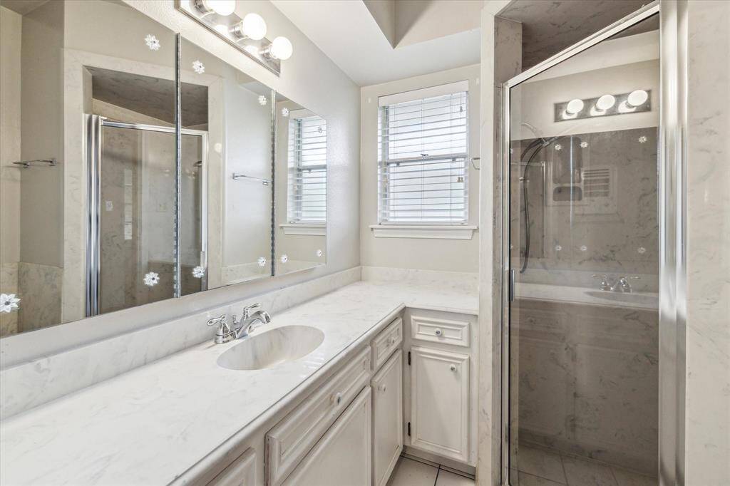 Primary bathroom with separate shower.