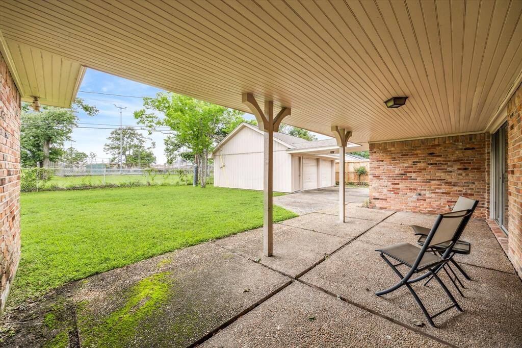 Expansive covered patio to sit back and relax. View of the backyard and Jaycee Park. Plenty of roof for your private pool. Fence gate leads to the park. Just a few feet away you can enjoy the many amenities--playground, walking trail, splash pad and tennis/pickleball courts.