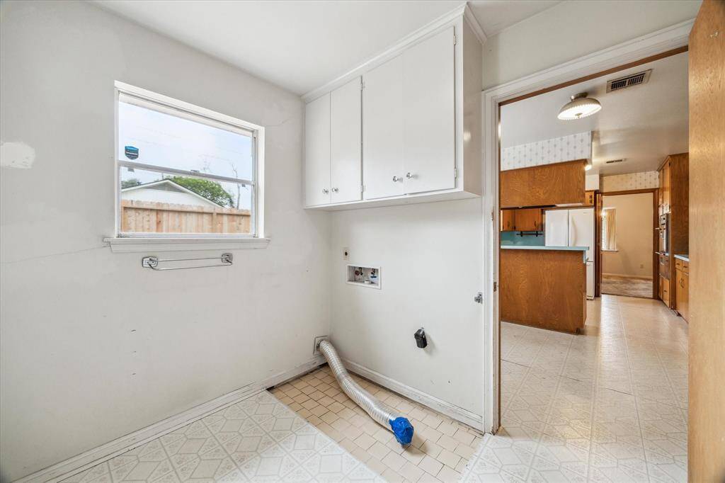 Laundry room with plenty of room to incorporate a mud room.  Powder room located in this room.