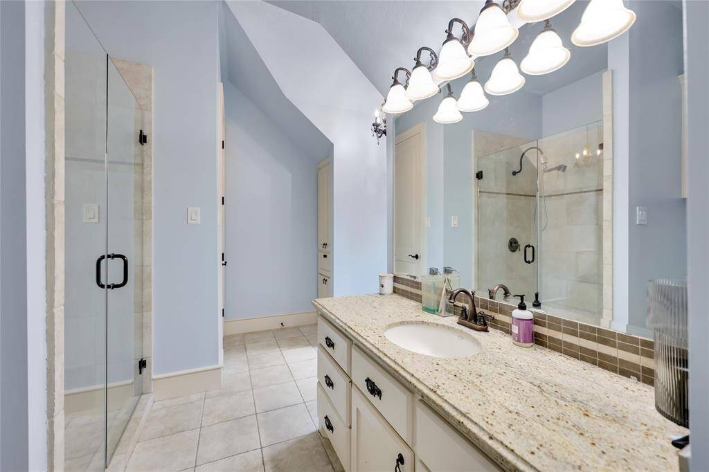 Upstairs bathroom with gameroom access.