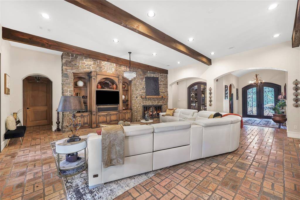 Built in entertainment center with stone fireplace.