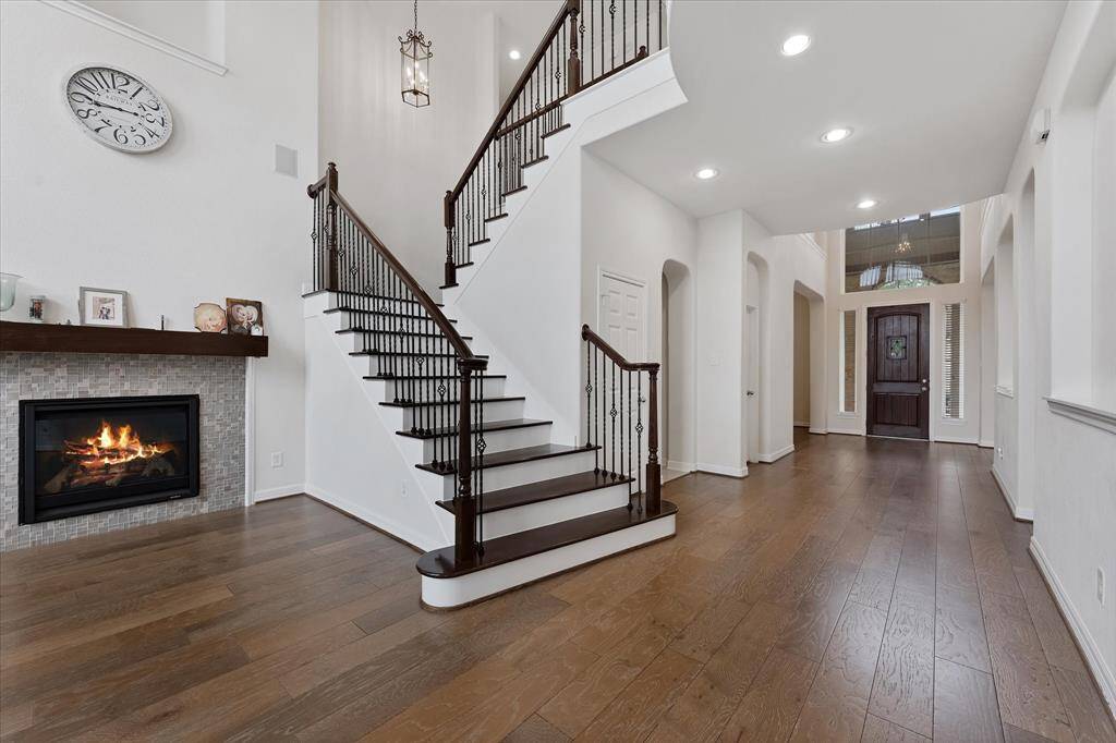 Staircase with wood treads to the upstairs gameroom, beds and baths