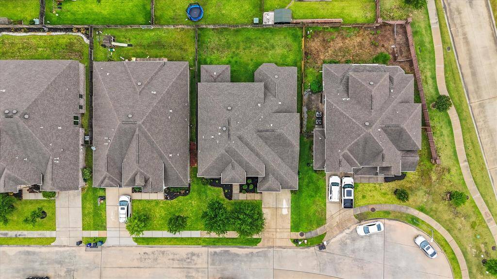 Aerial view of the home nestled on the lot