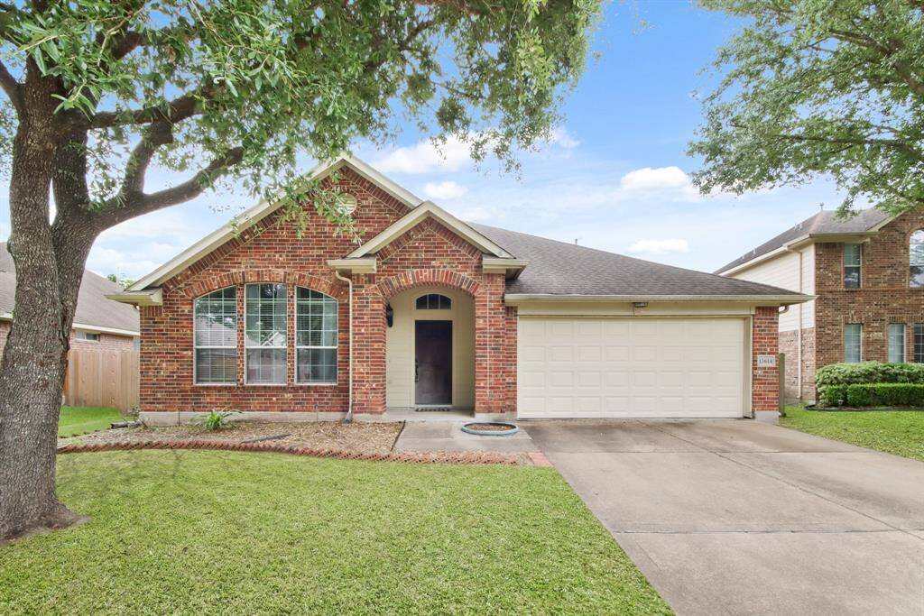 Charming single-story brick home with a two-car garage and well-maintained lawn. Features large front windows, a spacious driveway, and mature trees providing shade. Ideal for families seeking a cozy, welcoming neighborhood setting.