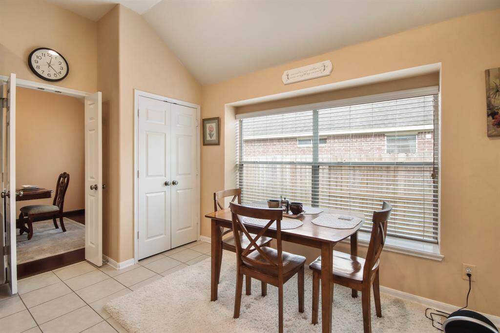Cozy breakfast area with large windows to provide natural warmth and sunlight. A spacious pantry sits just behind it for all of your kitchen storage.