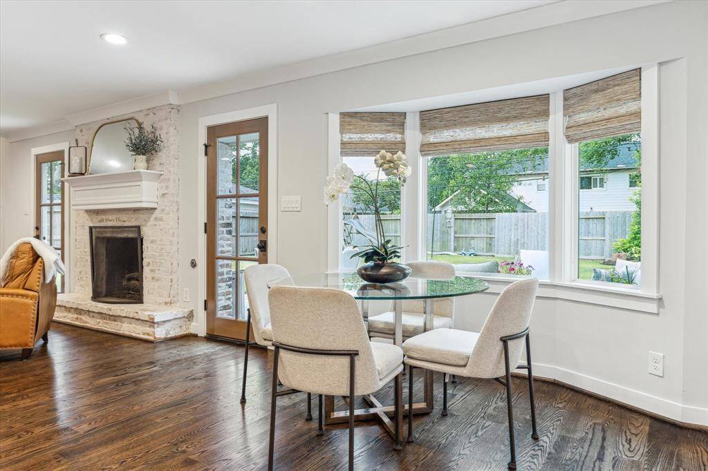 Kitchen dining overlooks the lush backyard.