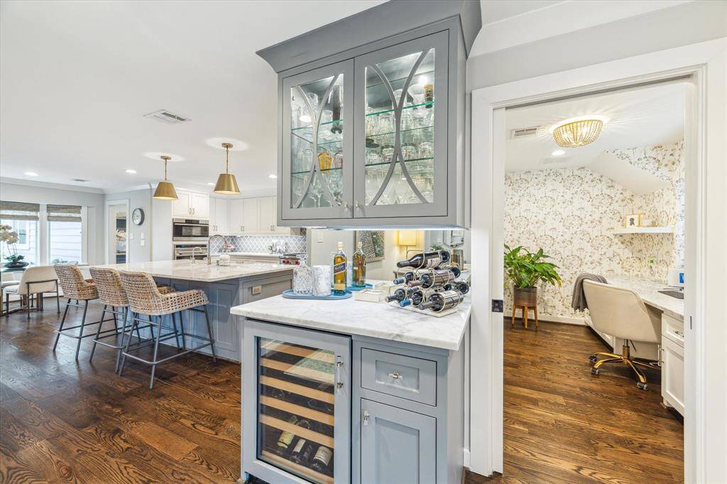 Charming beveled glass door fronts perfect for storing your barware ,and a wine refrigerator below for your favorite wine!