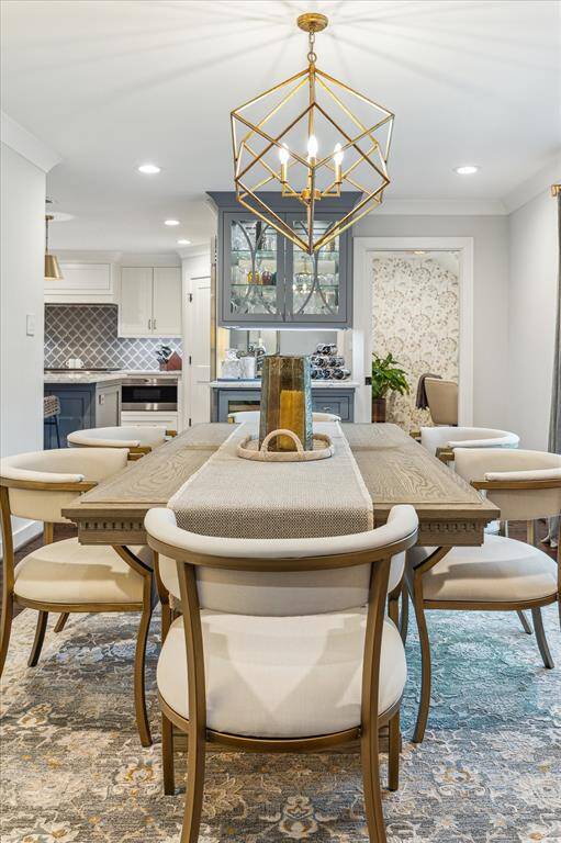 Dining area with dry bar and wine refrigerator. Perfect for entertaining!