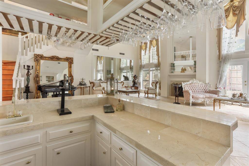 Owners had this bar custom made with granite counter top, sink with faucet and wall of mirrors.