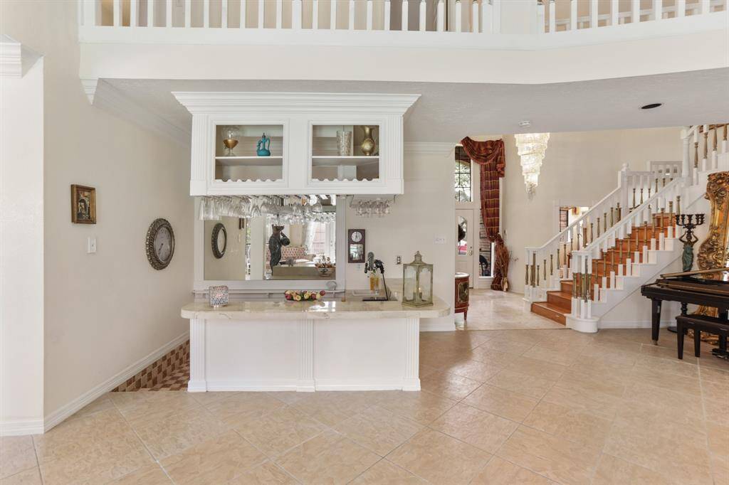 Closer view of the custom wet bar with great views of the entire formal areas.