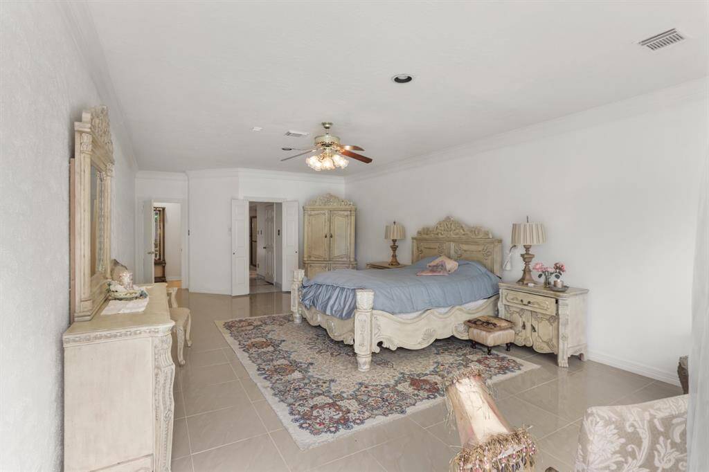 Guest Powder room located off the foyer with truly luxurious fixtures and custom vanity.