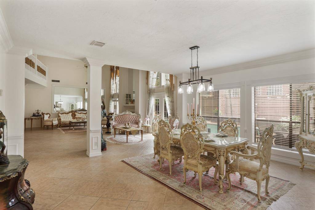 Separate shower and recent whirlpool soaking tub with beautiful chandelier.