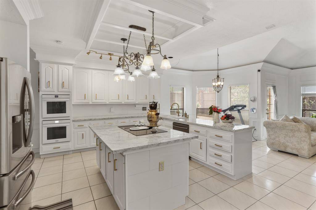 Extra large walk-in pantry with plenty of shelves and room for all your grocery needs.  Also, notice the butler area with all the extra cabinets and drawers so conveniently located by the back door.
