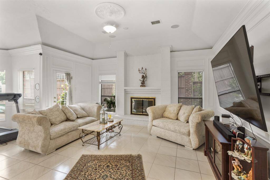 Located off the Kitchen is the breakfast room that is open to the family room
